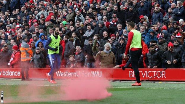 The smoke device on the pitch at Anfield during Liverpool's match against Chelsea
