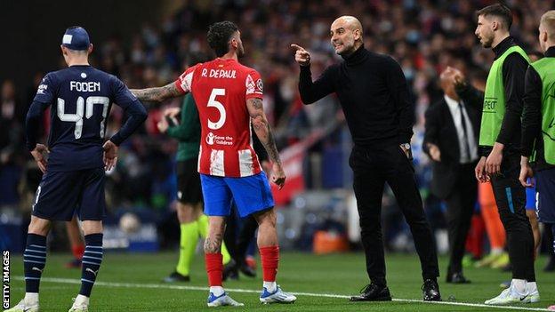 Pep Guardiola (second from right) points at Atletico's Rodrigo de Paul