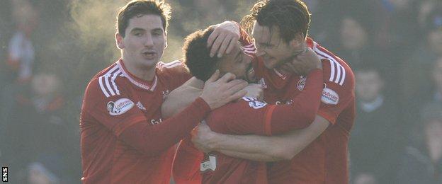 Aberdeen rallied from a goal and a man down to take three points at Ross County