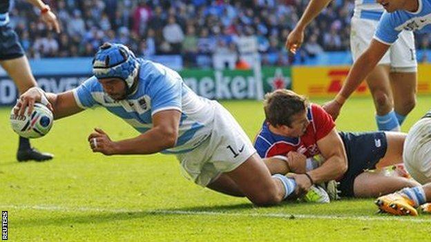 Argentina's Lucas Noguera scores a try against Namibia