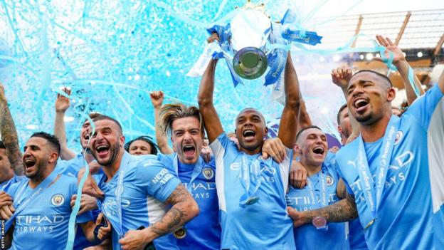 Manchester City's Fernandinho lifts the Premier League trophy