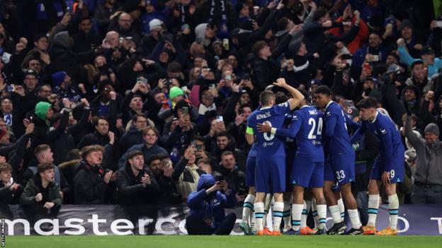 Chelsea players celebrate (right)