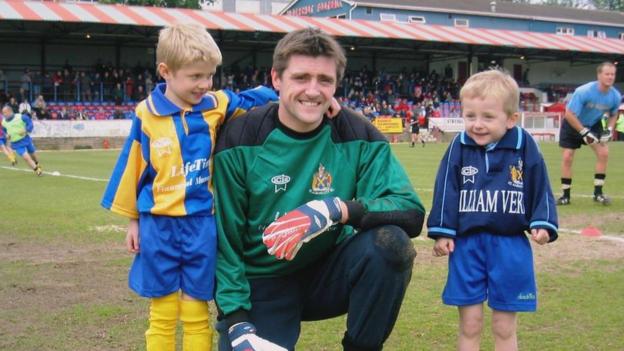 Joe, Richard and Ben Wilmot on the pitch before a St Albans City game