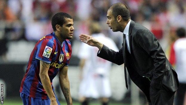 Pep Guardiola (right) with Daniel Alves