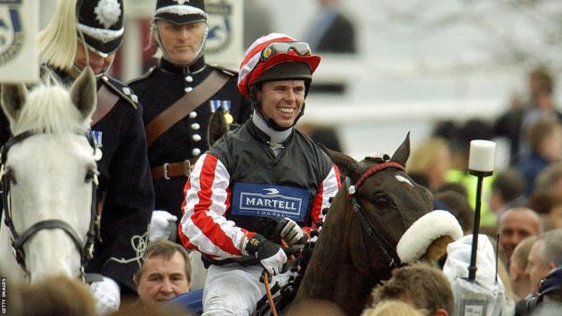 Graham Lee is led to the winner's circle on Amberleigh House after winning the Grand National at Aintree racecourse