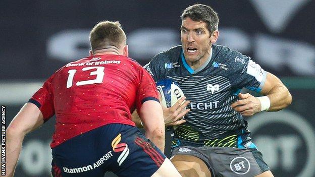 Ospreys replacement James Hook takes on Munster's Chris Farrell