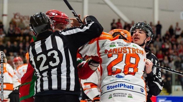 James Bettauer of Steelers and Mark Louis of Devils drop the gloves