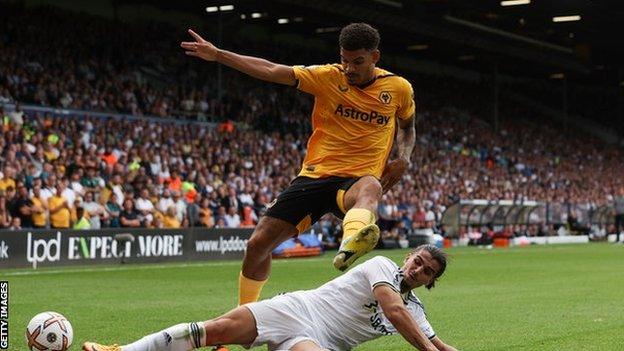 Morgan Gibbs-White is tackled by Pascal Struijk during Wolves' Premier League match against Leeds