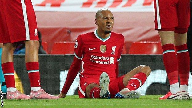 Fabinho lies injured on the pitch during Liverpool's Champions League group game with Midtjylland