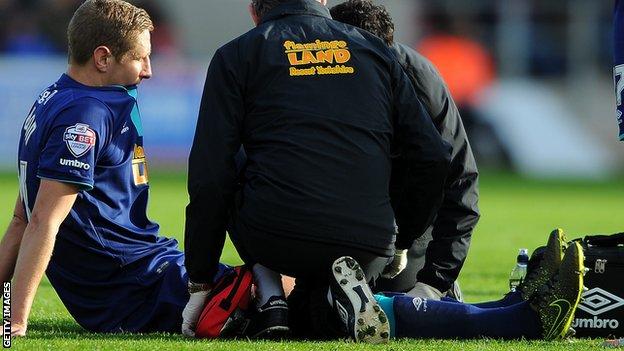 Hull captain Michael Dawson receives treatment against Bristol City