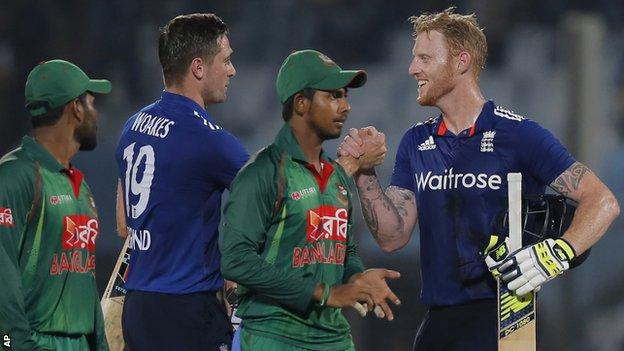 Chris Woakes and Ben Stokes celebrate England's victory