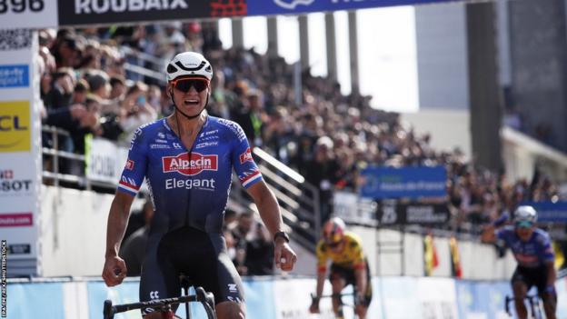 Mathieu van der Poel celebrates as he wins the 2023 Paris-Roubaix