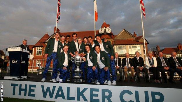 The US team celebrates with the trophy after winning the Walker Cup at Hoylake in 2019