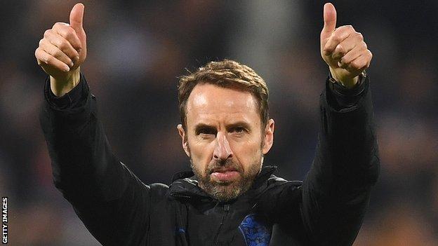 Gareth Southgate puts his thumbs up to England supporters