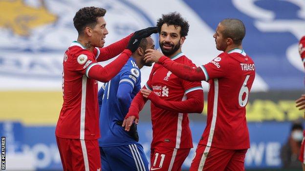 Liverpool striker Mohamed Salah (center)