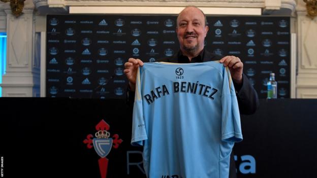 Rafael Benitez holds up a Celta Vigo shirt at his unveiling