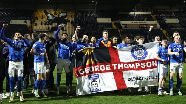 Stockport celebrate winning the title at Notts County's Meadow Lane