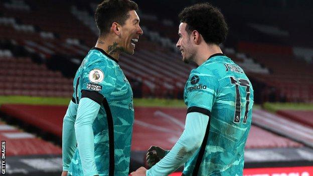 Curtis Jones celebrating with Roberto Firmino in the victory over Sheffield United