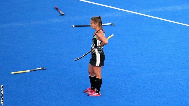 Anne Schroder looks on dejected after Germany's defeat against Spain in he 2018 Hockey Women's World Cup