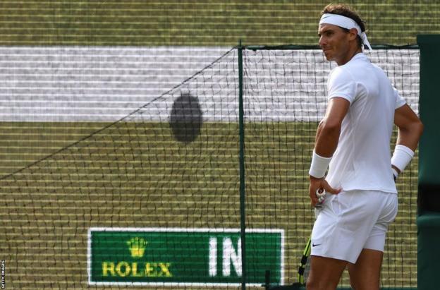 Rafael Nadal reacts to a electronic line call at Wimbledon