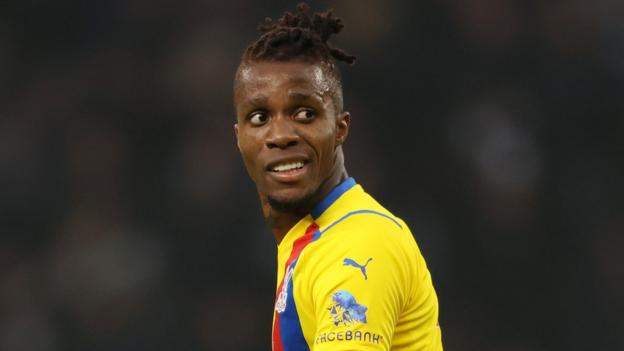 Crystal Palace's Wilfried Zaha looks over his shoulder