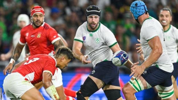 Caelan Doris (centre) offloads to Ireland team-mate Tadhg Beirne in last weekend's 59-16 win over Tonga