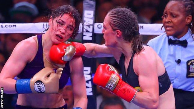 Katie Taylor is punched by Delfine Persoon in their first fight