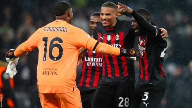 Milan celebrate beating Tottenham to reach the Champions League quarter-finals