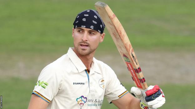 Derbyshire batter Leus du Plooy celebrates a century