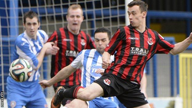 Coleraine midfielder Neil McCafferty challenges Crusaders winger Paul Heatley
