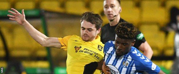 Livingston's Alan Forrest battles with Kilmarnock's Aaron Tshibola