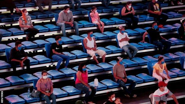 Spectators were told to sit two seats apart