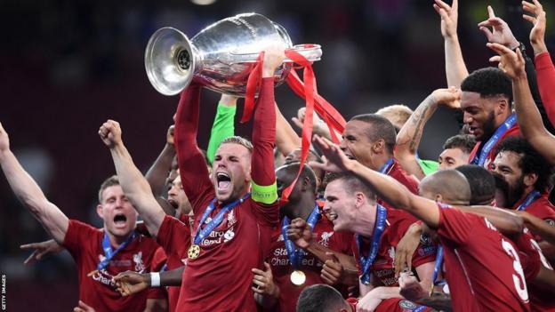 Jordan Henderson lifts the Champions League trophy after Liverpool beat Tottenham Hotspur in the 2019 final in Madrid