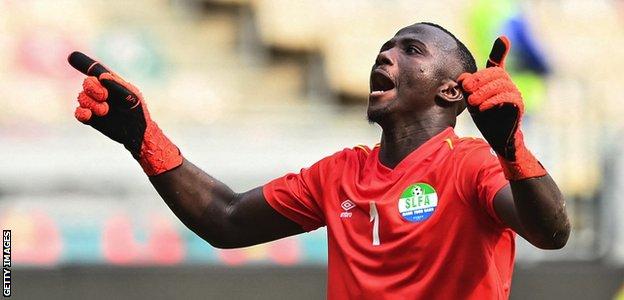 Mohamed Nbalie Kamara celebrates Sierra Leone's point against Algeria