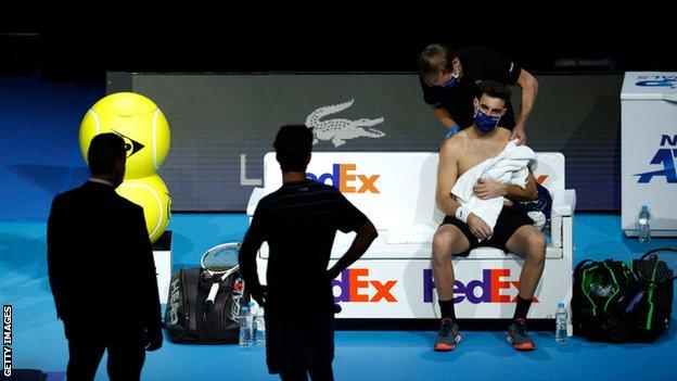 Marcel Granollers has treatment on his shoulder during his doubles match alongside Horacio Zeballos against Jurgen Melzer and Edouard Roger-Vasselin