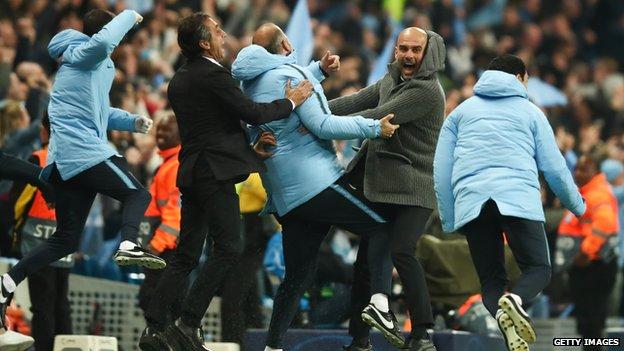 Pep Guardiola and the Manchester City coaching staff celebrate