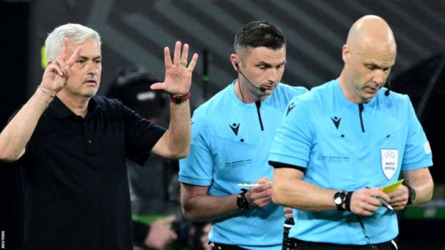 Roma manager   Jose Mourinho (left) and referee Anthony Taylor (right)