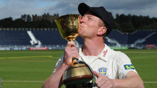 Paul Collingwood with the County Championship trophy in 2013