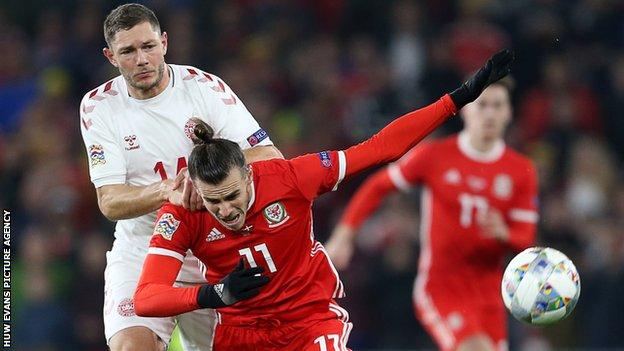 Gareth Bale of Wales is tackled by Henrik Dalsgaard