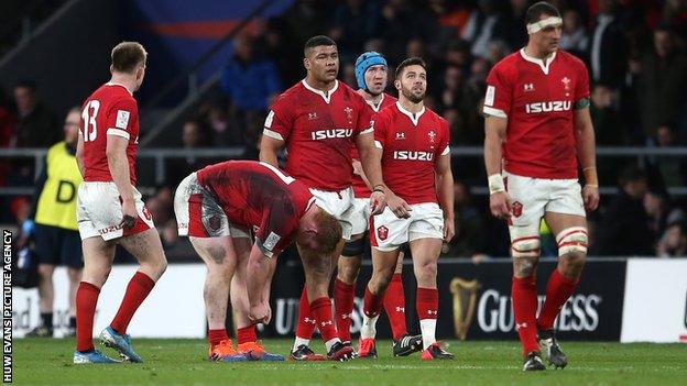 Wales players look dejected at final whistle at Twickenham