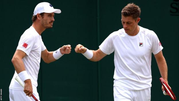Wesley Koolhof and Neal Skupski celebrate winning a point