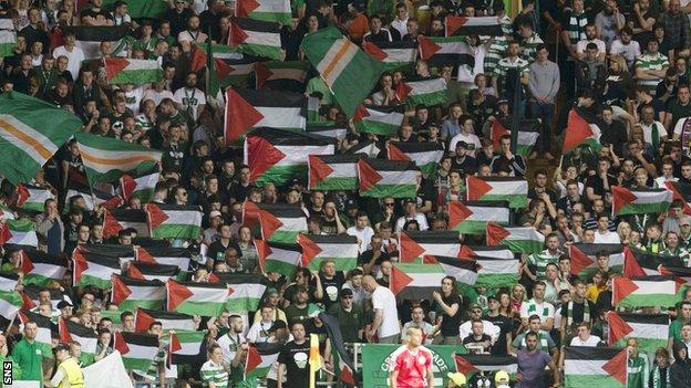 Fans display Palestine flags at Celtic's Champions League play-off first leg against Hapoel Beer Sheva