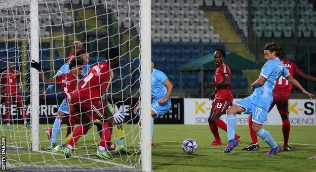 Filippo Fabbri of San Marino narrowly fails to make contact with a cross against Seychelles