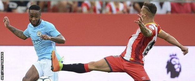 Raheem Sterling (L) vies with Girona"s defender Pablo Maffeo