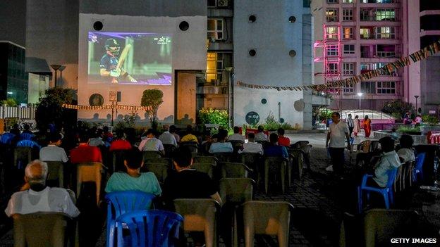 Residents at a complex in Chennai watched the match on a projector