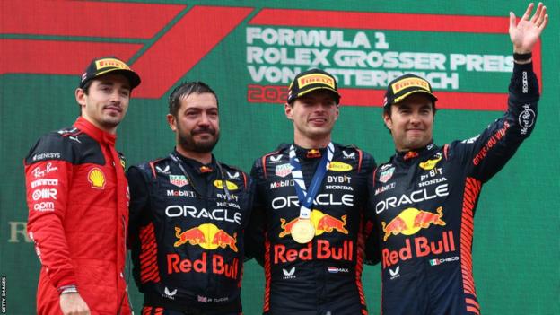 Charles Leclerc shares the Belgium Grand Prix podium with Max Verstappen and Sergio Perez