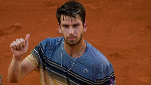 Cameron Norrie gives a thumbs up to the French Open crowd after beating Lucas Pouille