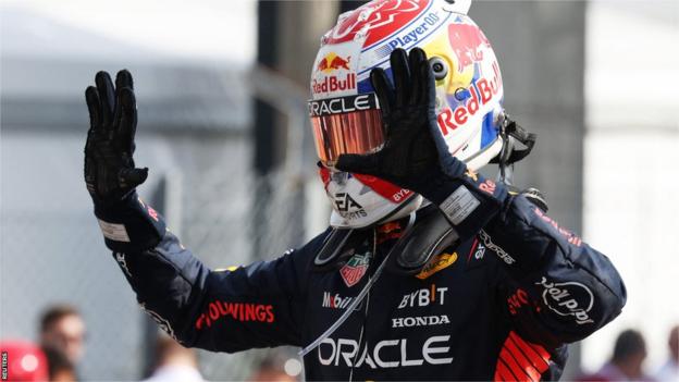 Max Verstappen holds up both his hands to show 10 digits after winning the Italian Grand Prix