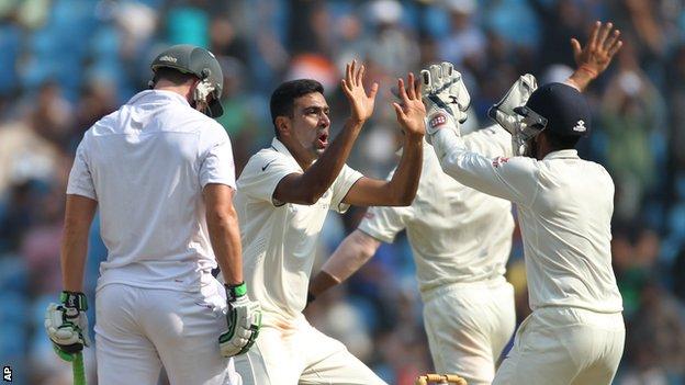 Ravichandran Ashwin (centre) celebrates a wicket