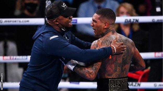 Conor Benn and Nigel Benn embrace